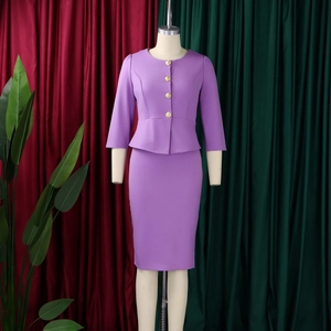 Detail of purple peplum jacket and skirt set featuring four decorative gold buttons