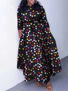 Elegant black maxi dress with colorful polka dots, long sleeves and belted waistline
