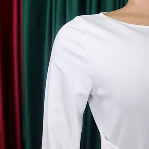 Detail of the clean round neckline and stitching on this solid white maxi dress