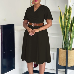 Detail of elegant V-neck wrap dress with ruffle sleeves and brown leather belt accent