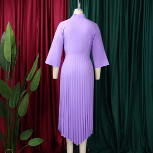 Detail of lavender midi dress featuring elegant pleated chiffon fabric and asymmetric hemline