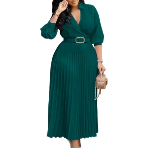 Detailed view of dark green pleated dress featuring elegant V-neck and gold buckle belt