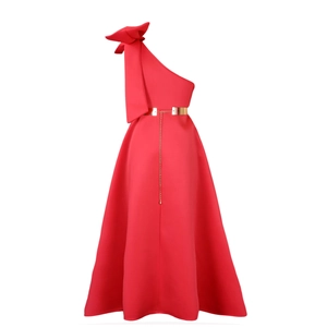 Detail of red one-shoulder evening gown with large bow and gold metal chain belt