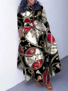 Elegant long-sleeve floral maxi dress with chain print, round neck and waist tie belt