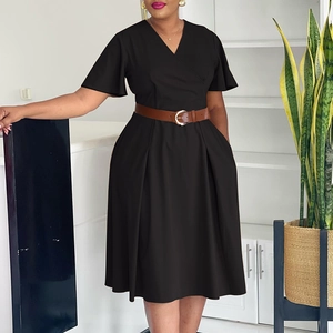 Detail of elegant black V-neck dress with long flare sleeves and brown leather waist belt