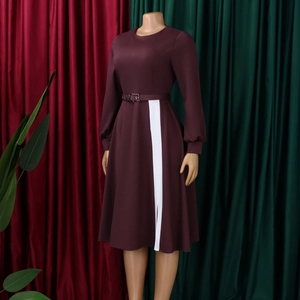 Detail of burgundy long sleeve dress featuring a waist belt and white contrast stripe