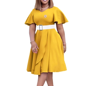 Detail of elegant bright yellow V-neck dress with ruffle sleeves and white decorative belt