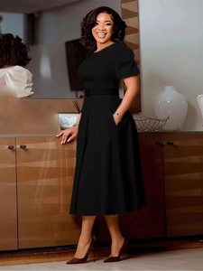 Elegant black puff sleeve A-line midi dress with crew neck and matching waist belt