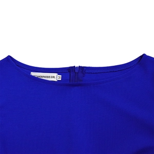 Detailed view of royal blue fabric texture with back zipper and sizing label