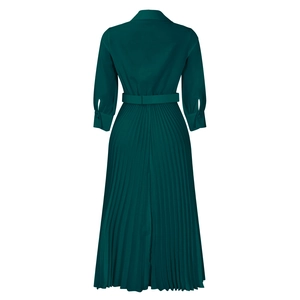Detail view of the back of a deep green pleated dress featuring a matching waist belt