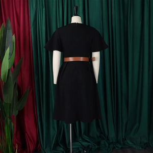 Rear view of an elegant black A-line dress featuring short sleeves and a brown leather belt