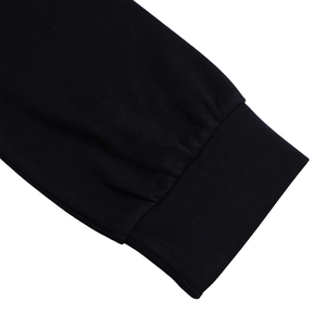 Close-up of the black ribbed knit cuffs on a stylish plus size round neck dress