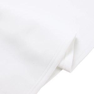 Macro shot of double-needle hem stitching on white fabric for elegant evening dresses