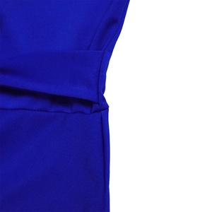 Macro detail of royal blue knit dress showing textured twill weave and layered sewing