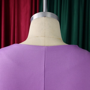 Detailed view of purple garment neckline stitching and back seam on fashion dress