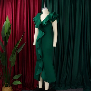 Deep V-neck dark green evening dress featuring ruffles and a mermaid split fishtail hemline