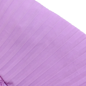 Detailed macro view of purple pleated knit fabric showing vertical ribbed texture and finish