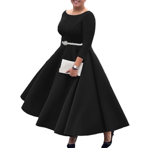 Detail view of long-sleeve black evening dress with beaded waist belt and flared skirt