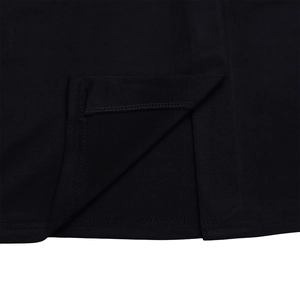 Detailed close-up of side slit stitching and premium fabric of a black bodycon dress