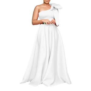 Detail of white one-shoulder evening gown with large bow and golden metal belt