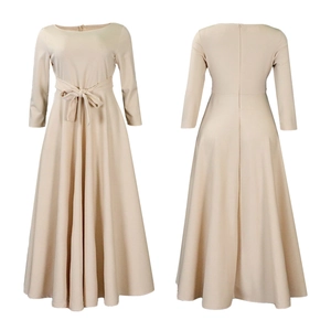Detail view showing front and back of beige maxi dress with high waist tie and A-line skirt