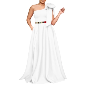 Detail of white one-shoulder evening gown featuring a giant bow and golden mirror belt