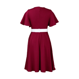 Detail view of the back of a burgundy plus size dress with ruffle sleeves and white belt