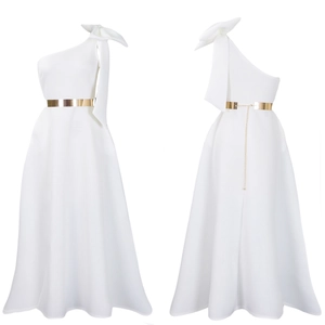 Detail view of white one-shoulder evening dress with oversized bow and gold chain belt