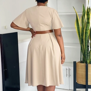 Rear view of a beige V-neck pleated maxi dress with elegant flared sleeves and brown belt