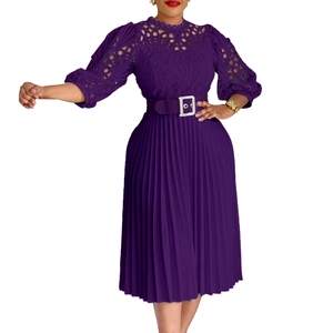 Detail of lace floral cutouts and pleated skirt on a purple elegant midi dress