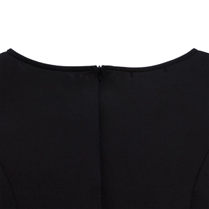 Detail of elegant black evening dress neckline with neat stitching and invisible back zipper