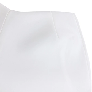 Detail of premium white fabric showing fine stitching and elegant waist dart tailoring