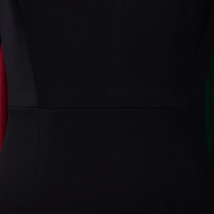 Close-up of elegant black dress showing high-quality stitching and fine woven texture