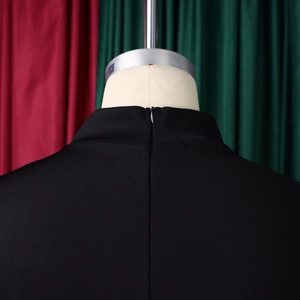 Detail of the invisible back zipper closure on this elegant black high-neck dress