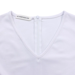 Close-up of white V-neck dress detail with invisible KCC zipper and fabric texture