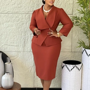 Detail of cross-collar blazer with waist belt and midi skirt in dark rust red