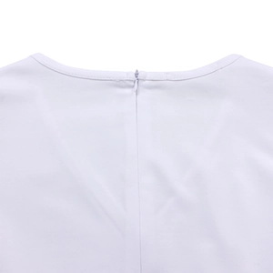 Detail view of the elegant white dress featuring a round neck and invisible back zipper