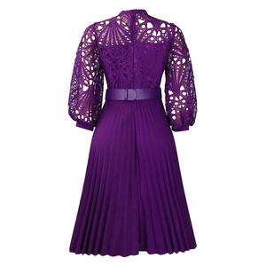 Detail view of purple dress featuring intricate lace hollow-out design and pleated chiffon back
