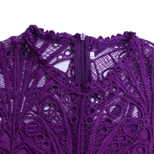 Detail of purple lace dress neckline with intricate crochet hollow-out design and zipper