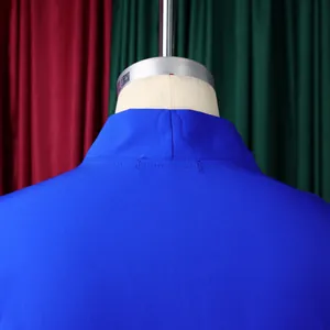 Detail of royal blue mandarin collar dress with delicate stitching and pleats
