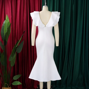 Detail view of the back V-neckline and elegant ruffles on this white mermaid evening gown