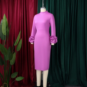 Detail of elegant purple slim-fit dress featuring decorative 3D floral pleated cuffs