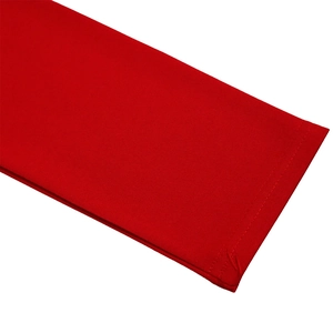 Detailed macro shot of red knitted dress sleeve with durable double-needle coverstitch seam