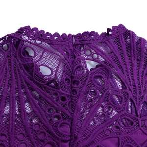 Detail shot of purple lace hollow-out pattern and hidden zipper on the elegant dress