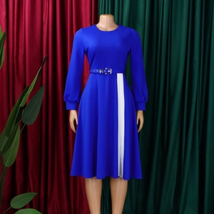 Detail of blue long sleeve dress featuring an elegant side white stripe and matching belt