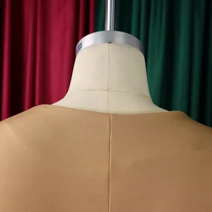 Detailed view of the back seam on a camel-colored knit top with premium fabric texture