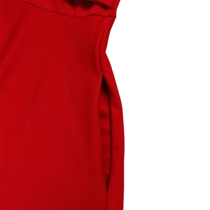Detail shot of a red maxi dress showing side pocket stitching on woven fabric