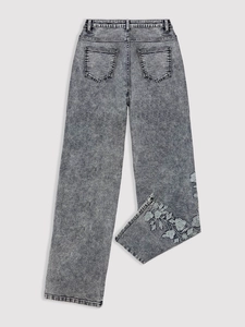 Acid wash grey high-waist denim pants featuring intricate blue floral embroidery details