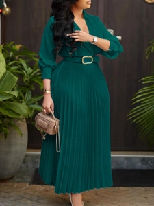 Elegant deep green V-neck pleated maxi dress with long lantern sleeves and a belted waist