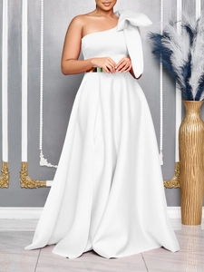 Elegant white one-shoulder evening gown with large bow detail and gold waist belt